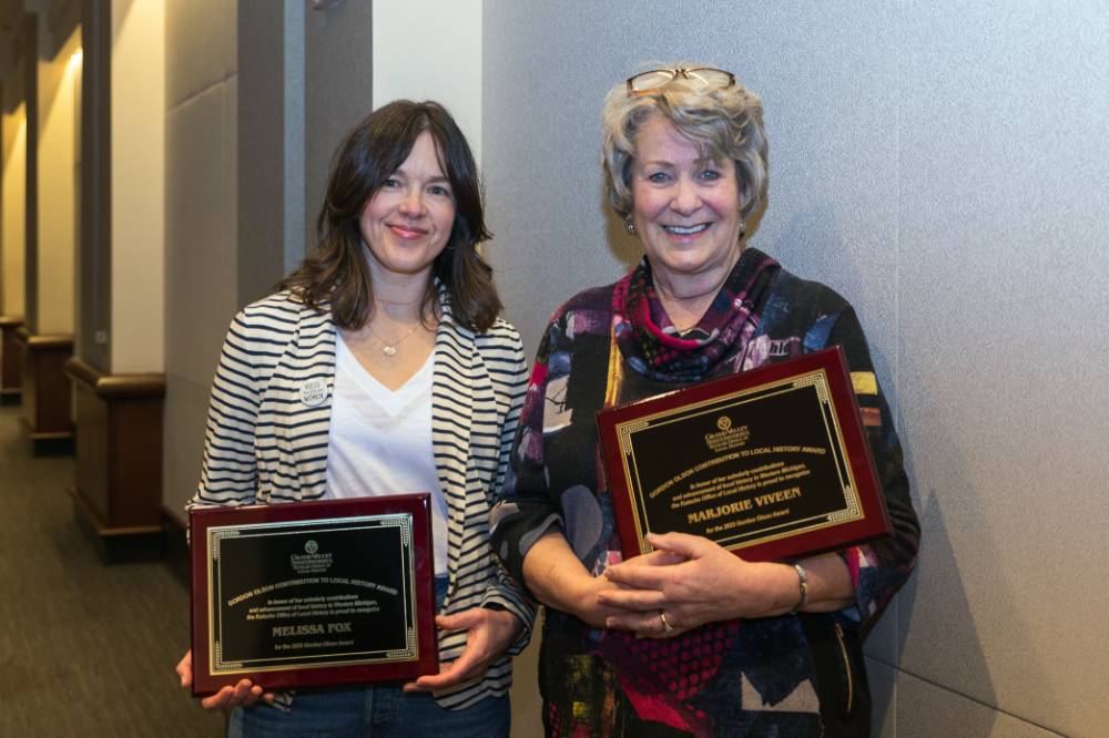 Two women with plaques